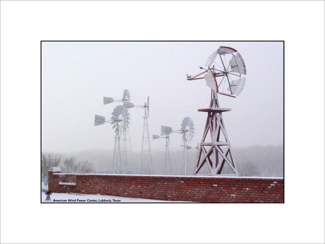 Snow Covered Windmill and Fence