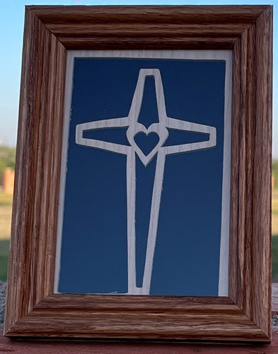 Framed wooden cross with heart.