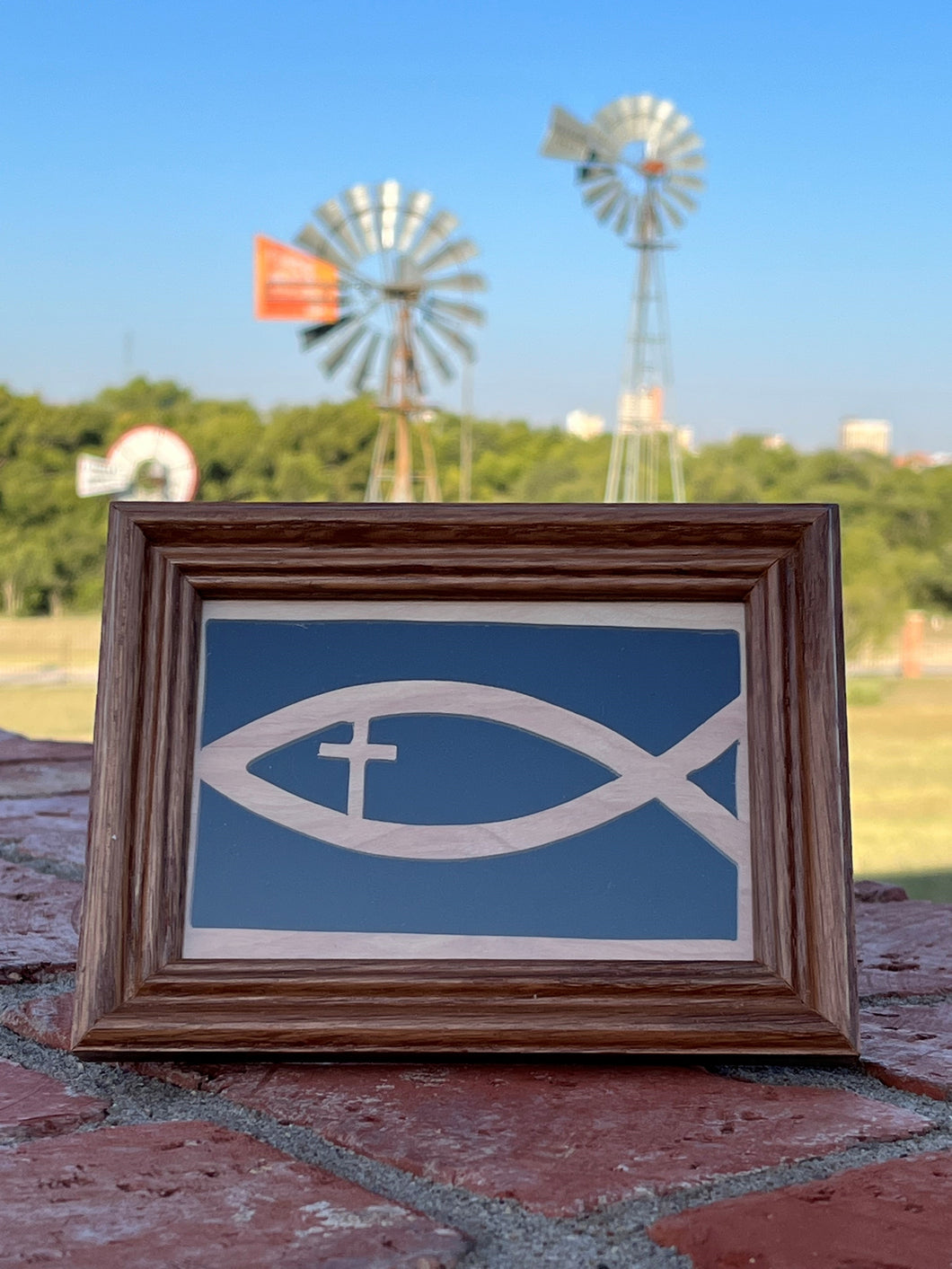 Framed wooden fish with cross